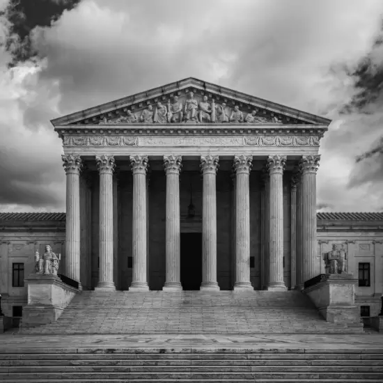 Dramatic black and white image of the US Supreme Court in Washington, DC
